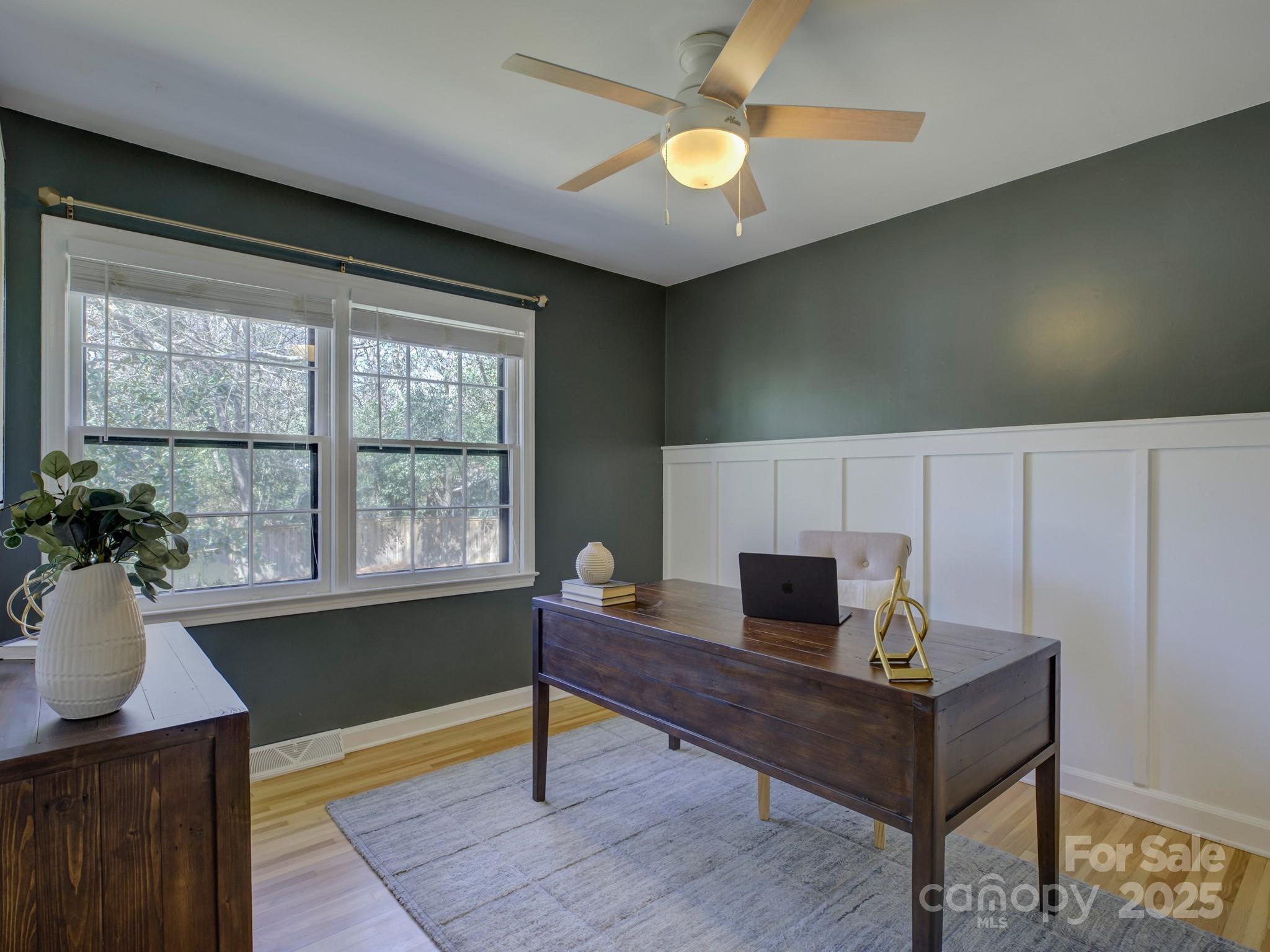 1225 Braeburn Road Charlotte, NC 28211 - Photo 25 of 45 a living room with furniture and a potted plant