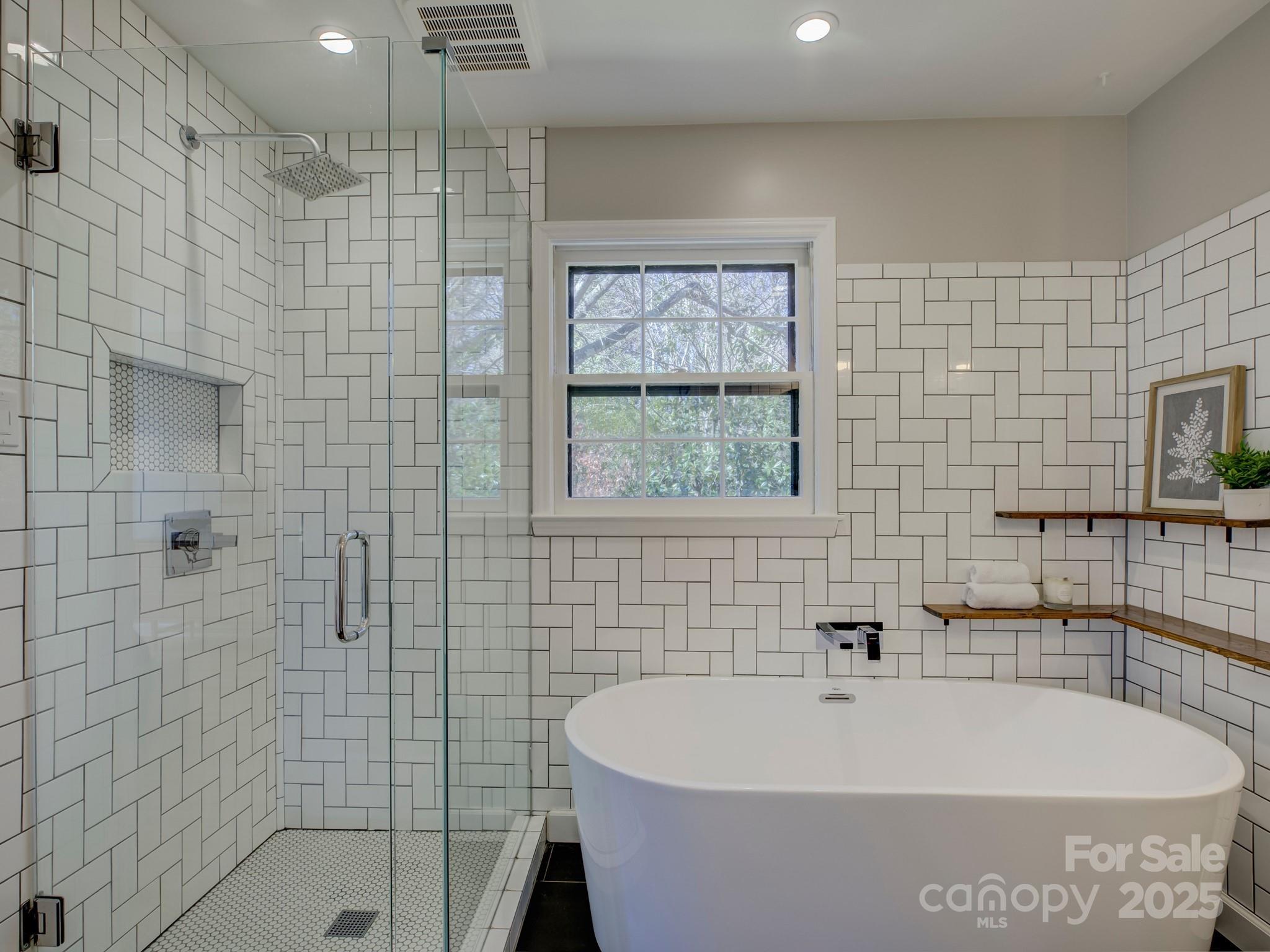1225 Braeburn Road Charlotte, NC 28211 - Photo 32 of 45 a bathroom with a bathtub and shower