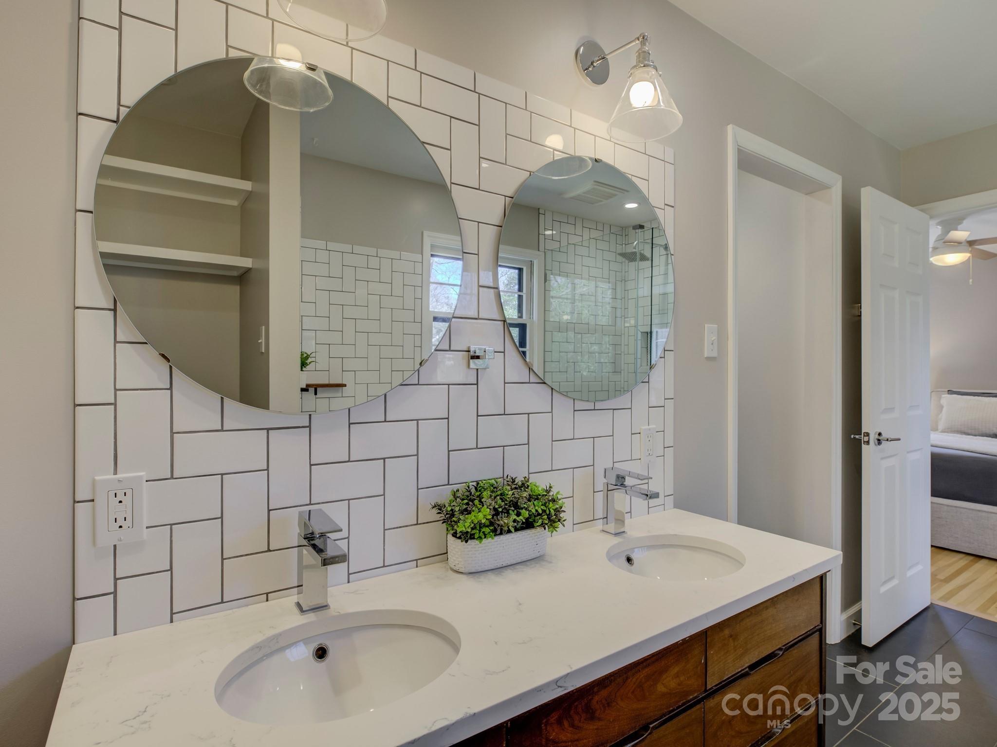 1225 Braeburn Road Charlotte, NC 28211 - Photo 33 of 45 a bathroom with a sink and a mirror