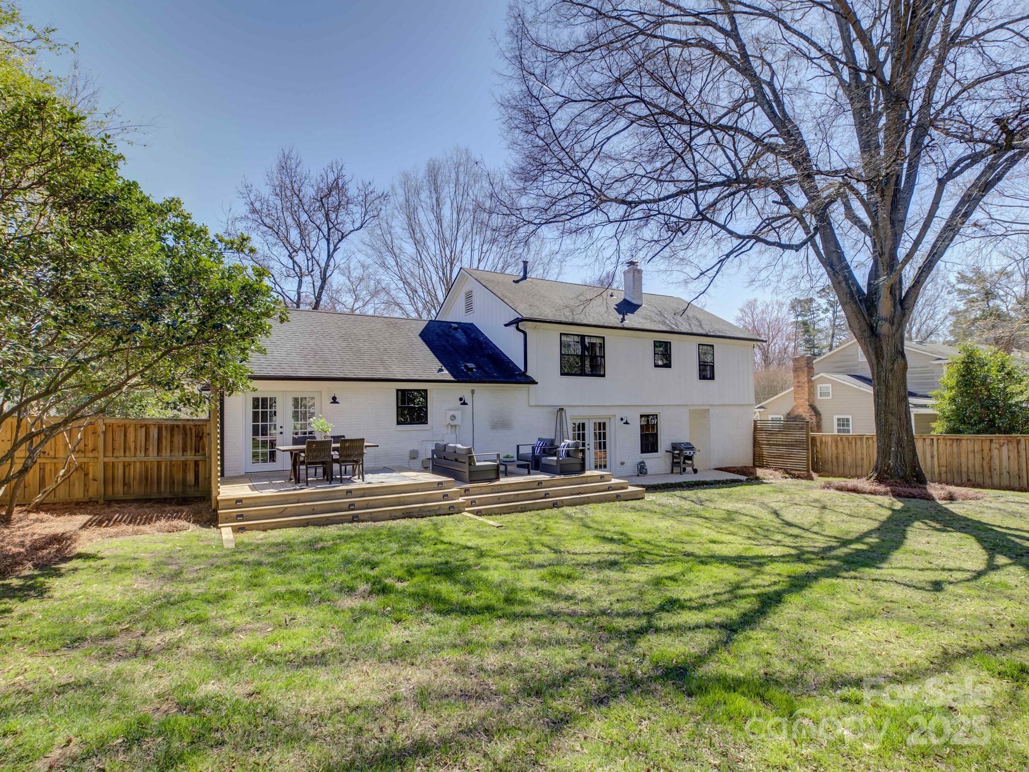 1225 Braeburn Road Charlotte, NC 28211 - Photo 35 of 45 a view of a house with backyard and sitting area