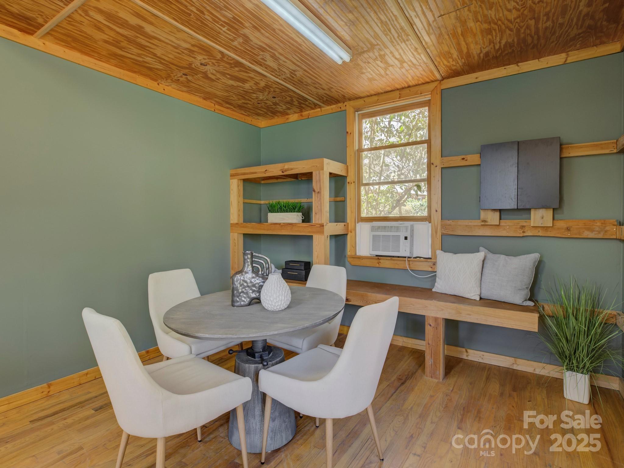 1225 Braeburn Road Charlotte, NC 28211 - Photo 42 of 45 a view of a dining room with furniture window and wooden floor