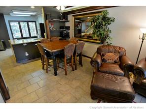 1944 Soda Ridge Road, Unit 229 Keystone, CO 80435 - Photo 13 of 25 a view of a dining room with furniture and chandelier