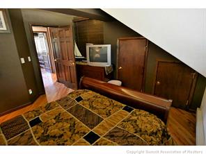 1944 Soda Ridge Road, Unit 229 Keystone, CO 80435 - Photo 18 of 25 a living room with a couch and a flat screen tv