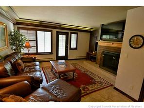 1944 Soda Ridge Road, Unit 229 Keystone, CO 80435 - Photo 21 of 25 a living room with furniture and a flat screen tv