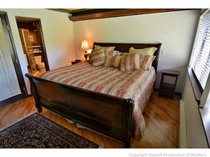 1944 Soda Ridge Road, Unit 229 Keystone, CO 80435 - Photo 6 of 25 a bed sitting in a bedroom next to a window