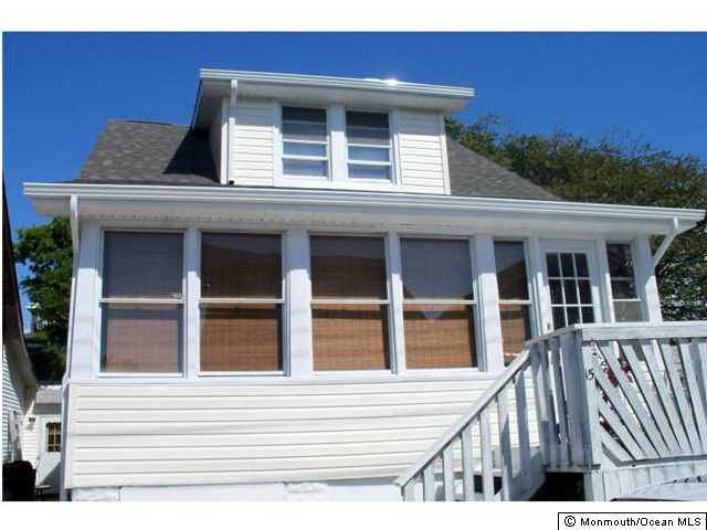 a view of a house with a window and balcony