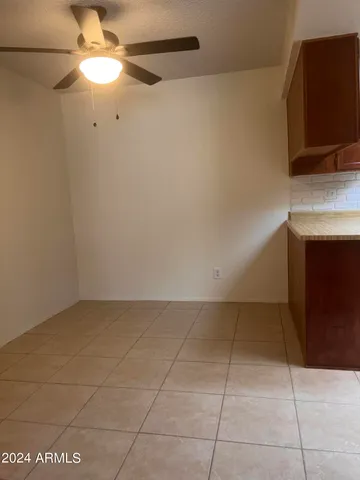 a view of an empty room with a fireplace