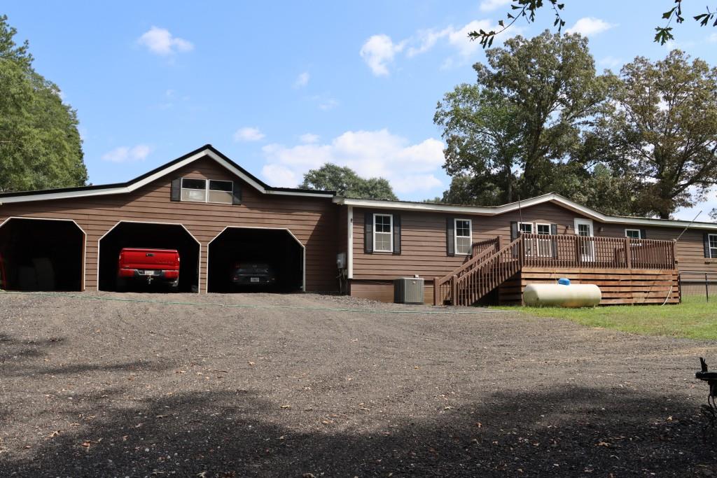1189 Paul Harris Road Dallas, GA 30157 - Photo 14 of 44 a front view of a house with garden