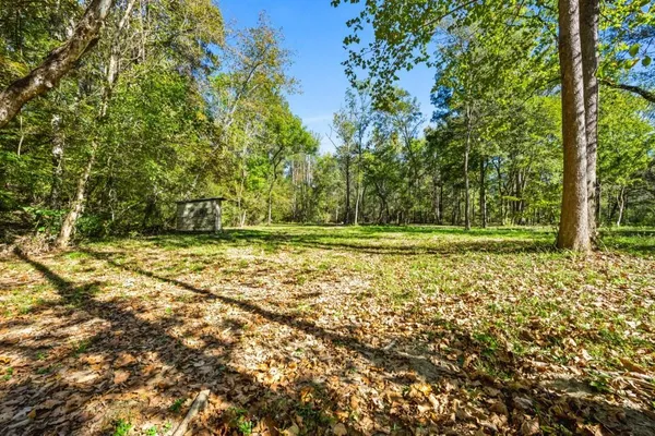 a view of outdoor space with deck and yard