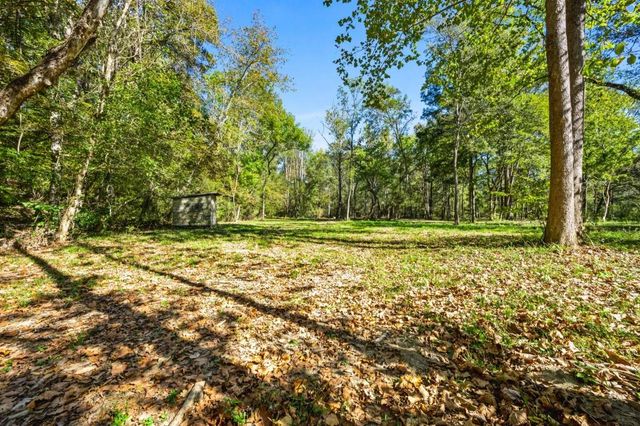 a view of outdoor space with deck and yard