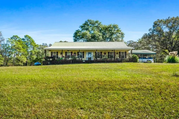 a view of a house with a swimming pool