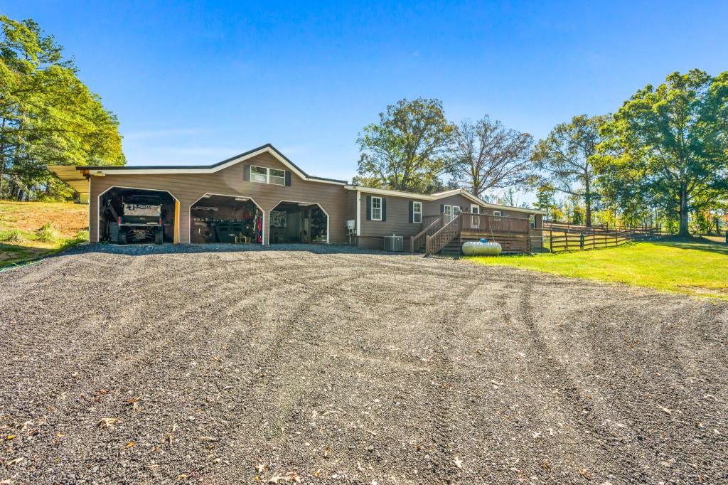 1189 Paul Harris Road Dallas, GA 30157 - Photo 35 of 44 a view of a house with a yard and swimming pool