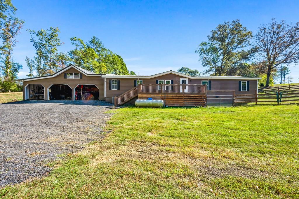 1189 Paul Harris Road Dallas, GA 30157 - Photo 36 of 44 a front view of a house with a yard table and chairs