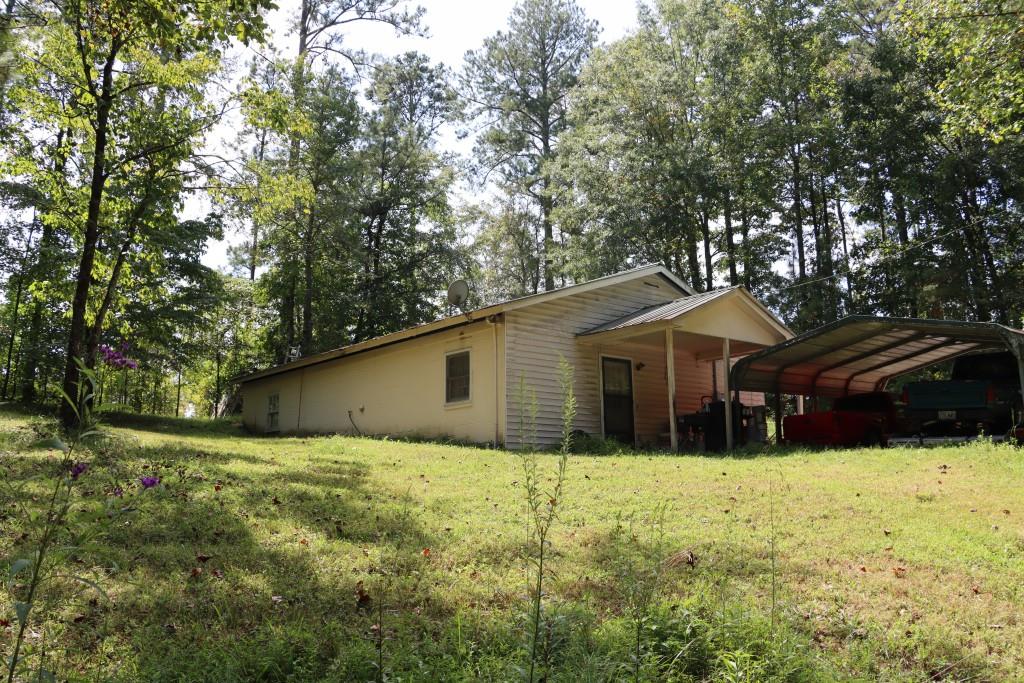 1189 Paul Harris Road Dallas, GA 30157 - Photo 9 of 44 a house with trees in the background