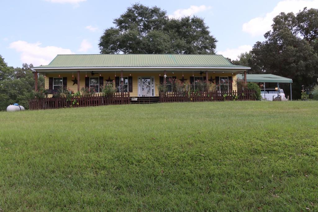 1189 Paul Harris Road Dallas, GA 30157 - Photo 10 of 44 a front view of house with yard outdoor seating and green space