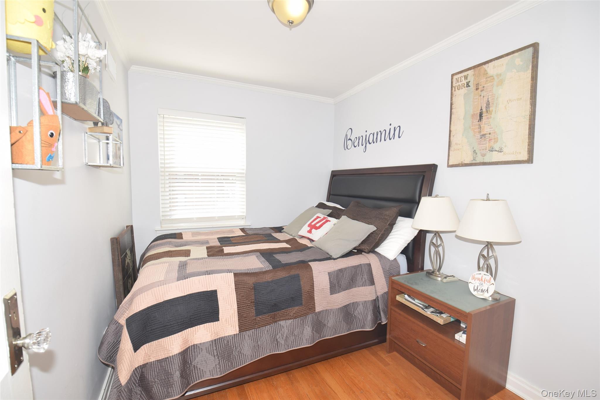 105-48 65th Road Queens, NY 11375 - Photo 10 of 17 a bedroom with a bed and window