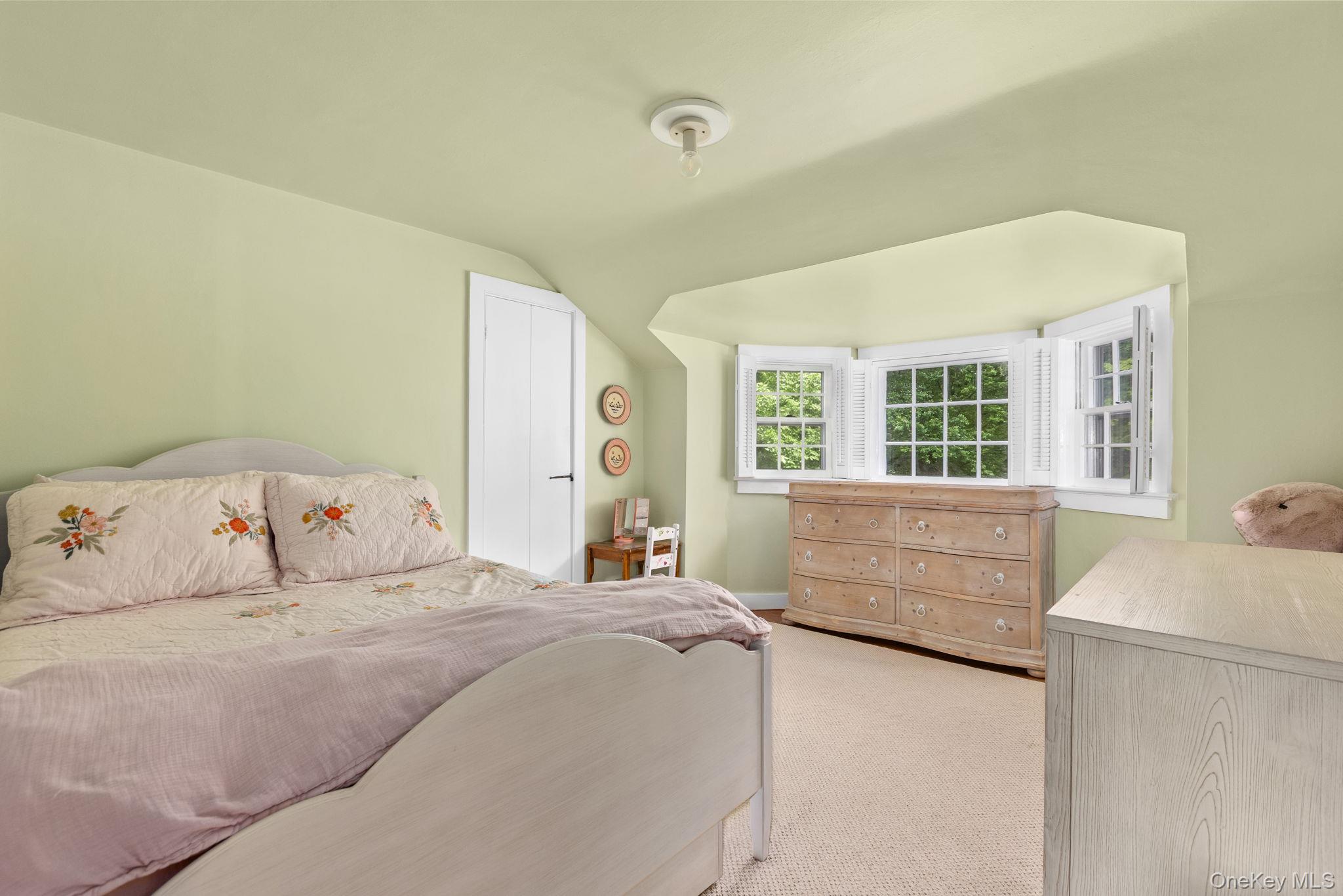 23 Pound Ridge Road Pound Ridge, NY 10576 - Photo 20 of 40 a bedroom with a large bed and a window