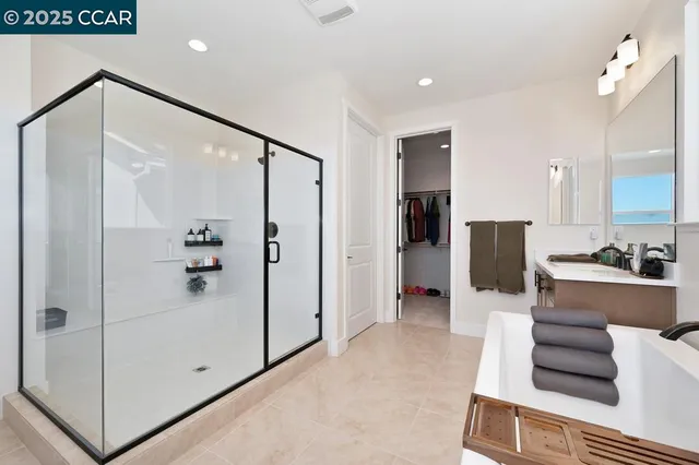 a bathroom with a bathtub and a shower