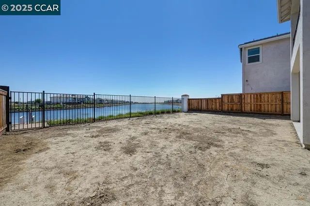 a view of a house with a yard and garage