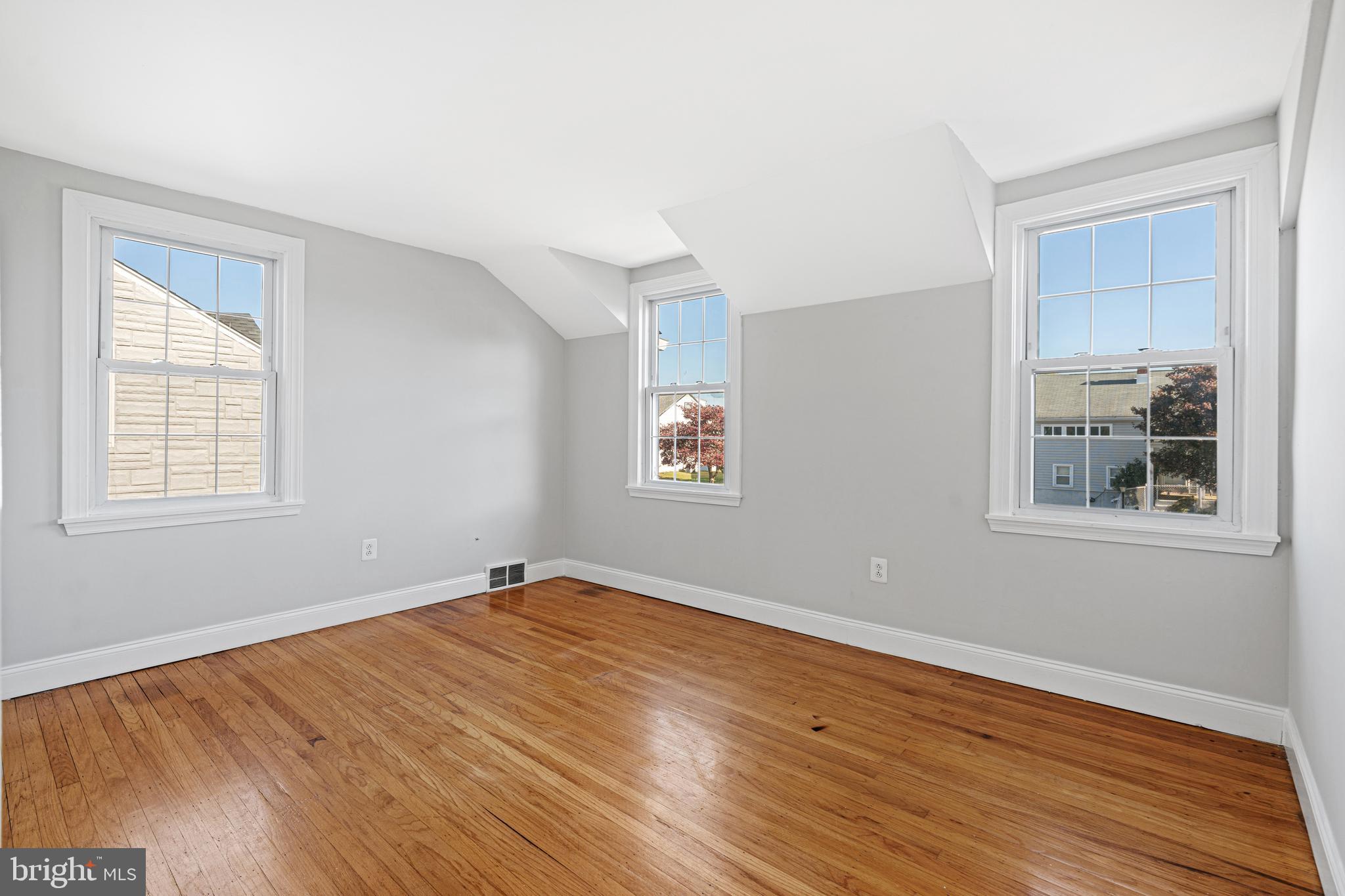 1344 Sunset Street Marcus Hook, PA 19061 - Photo 13 of 22 a view of empty room with wooden floor and fan