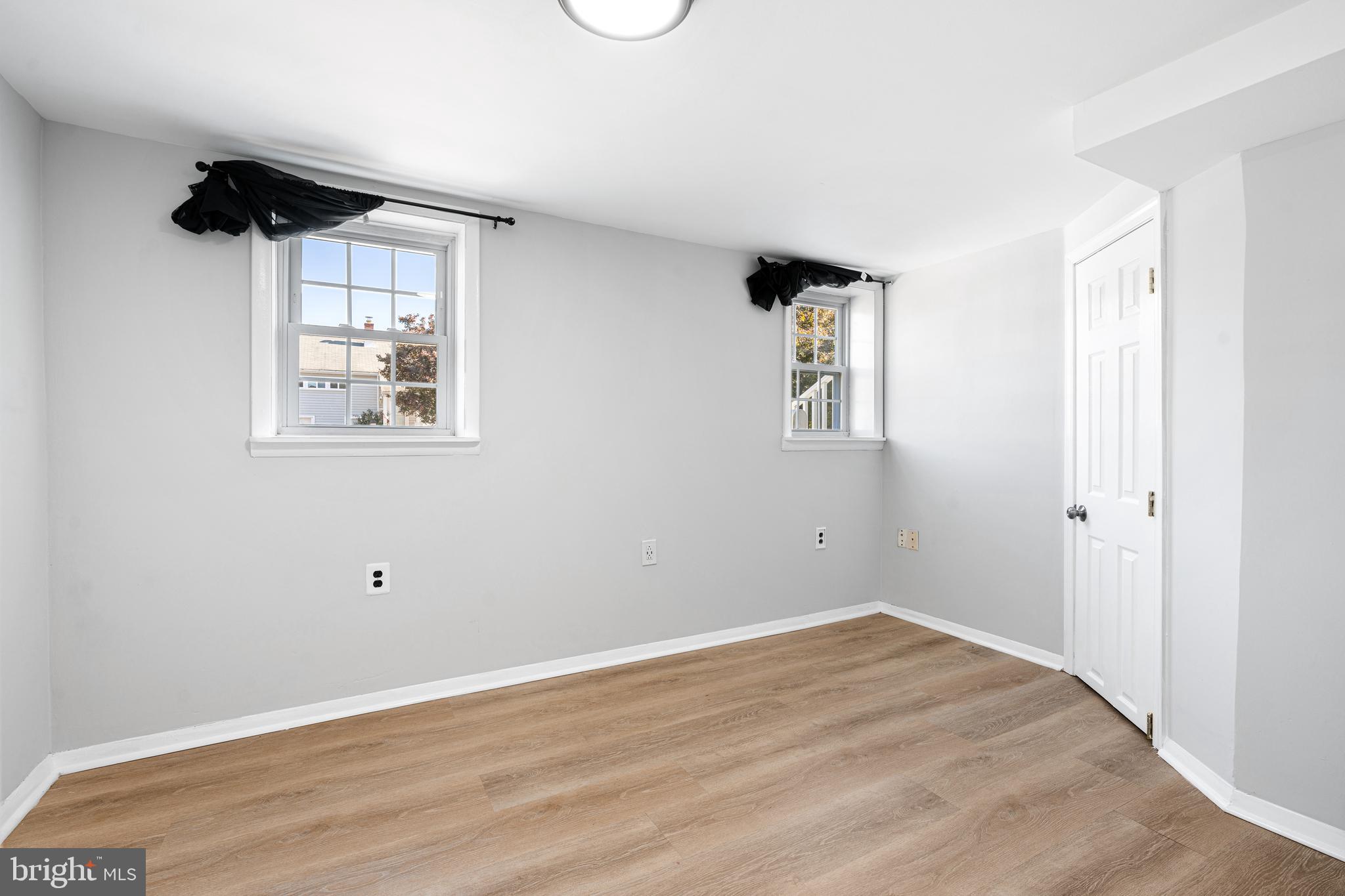 1344 Sunset Street Marcus Hook, PA 19061 - Photo 16 of 22 a view of room with a window and wooden floor