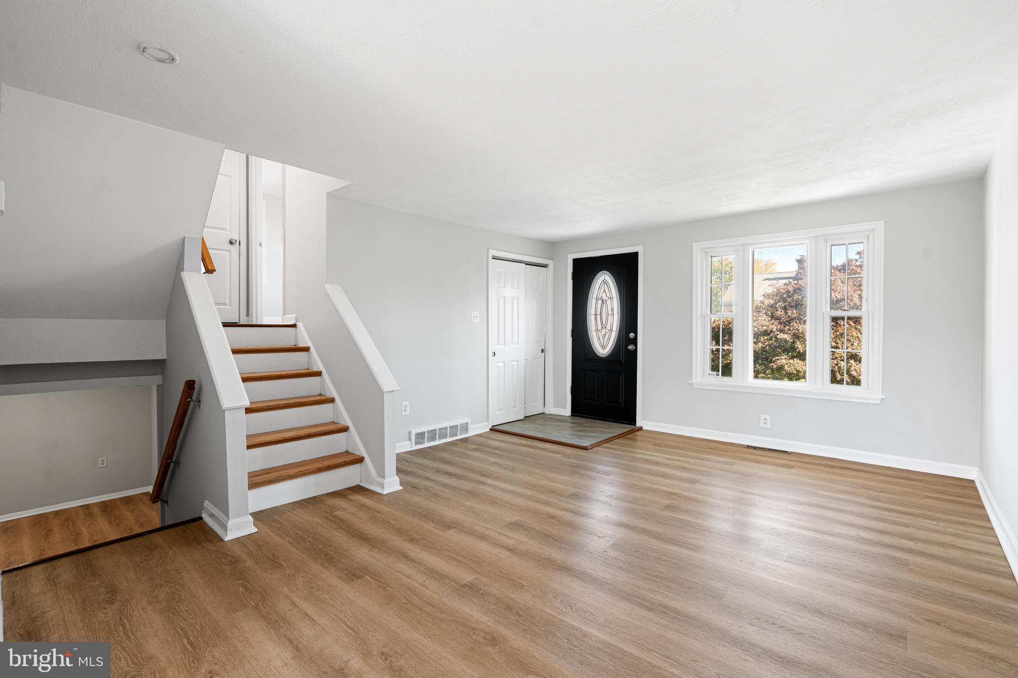 1344 Sunset Street Marcus Hook, PA 19061 - Photo 4 of 22 wooden floor in an empty room with a window