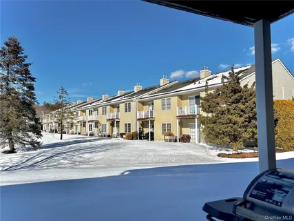 a front view of a house with snow