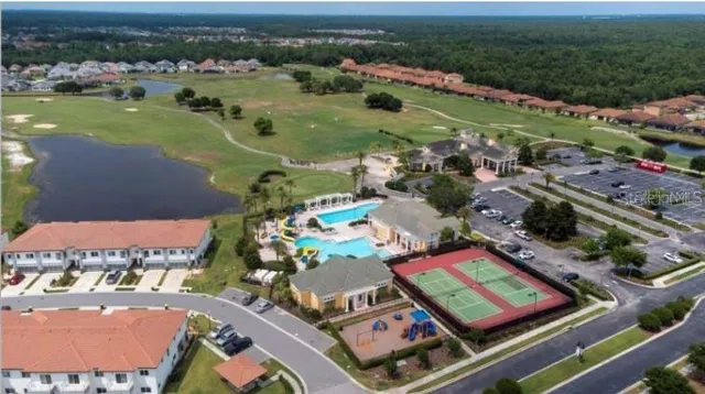 an aerial view of a house with a lake view