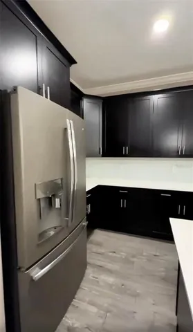 a bathroom with a double vanity and a bathtub