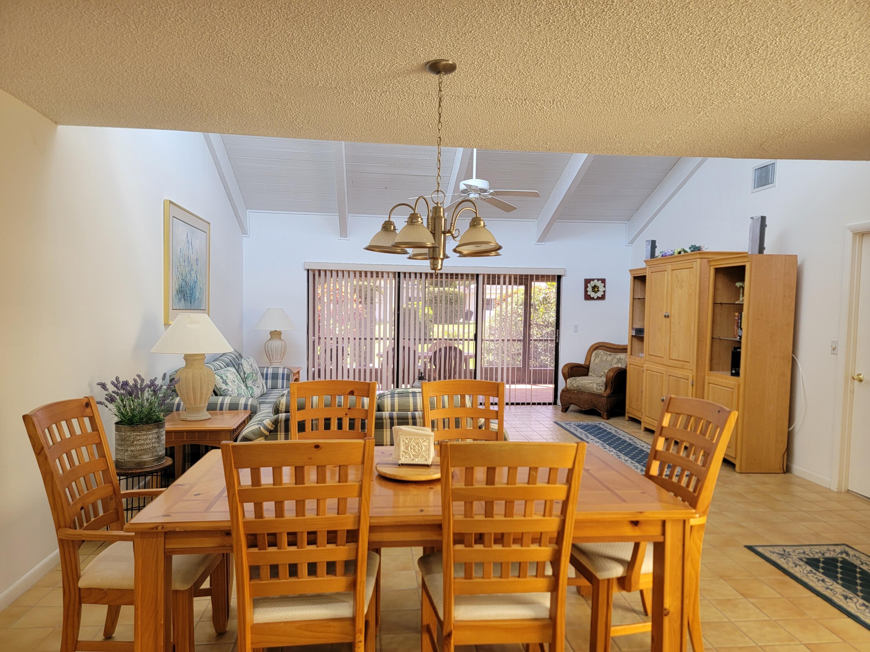 11115 Oakdale Road Boynton Beach, FL 33437 - Photo 15 of 30 a view of a dining room with furniture window and outside view