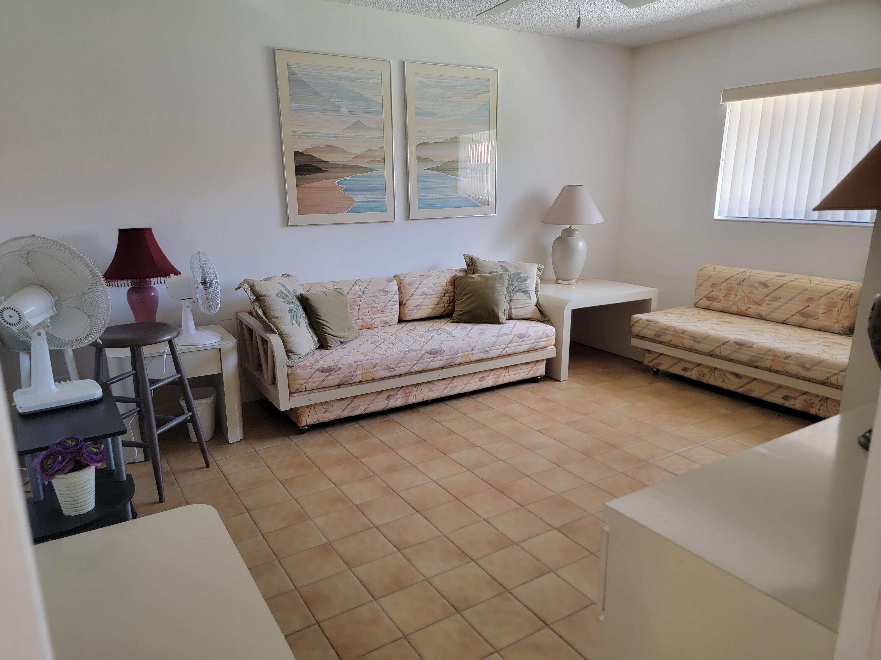11115 Oakdale Road Boynton Beach, FL 33437 - Photo 19 of 30 a living room with furniture and a couch