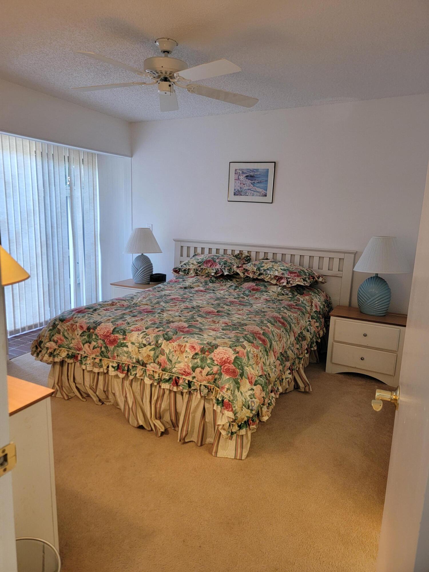11115 Oakdale Road Boynton Beach, FL 33437 - Photo 20 of 30 a bed sitting in a bedroom next to a window