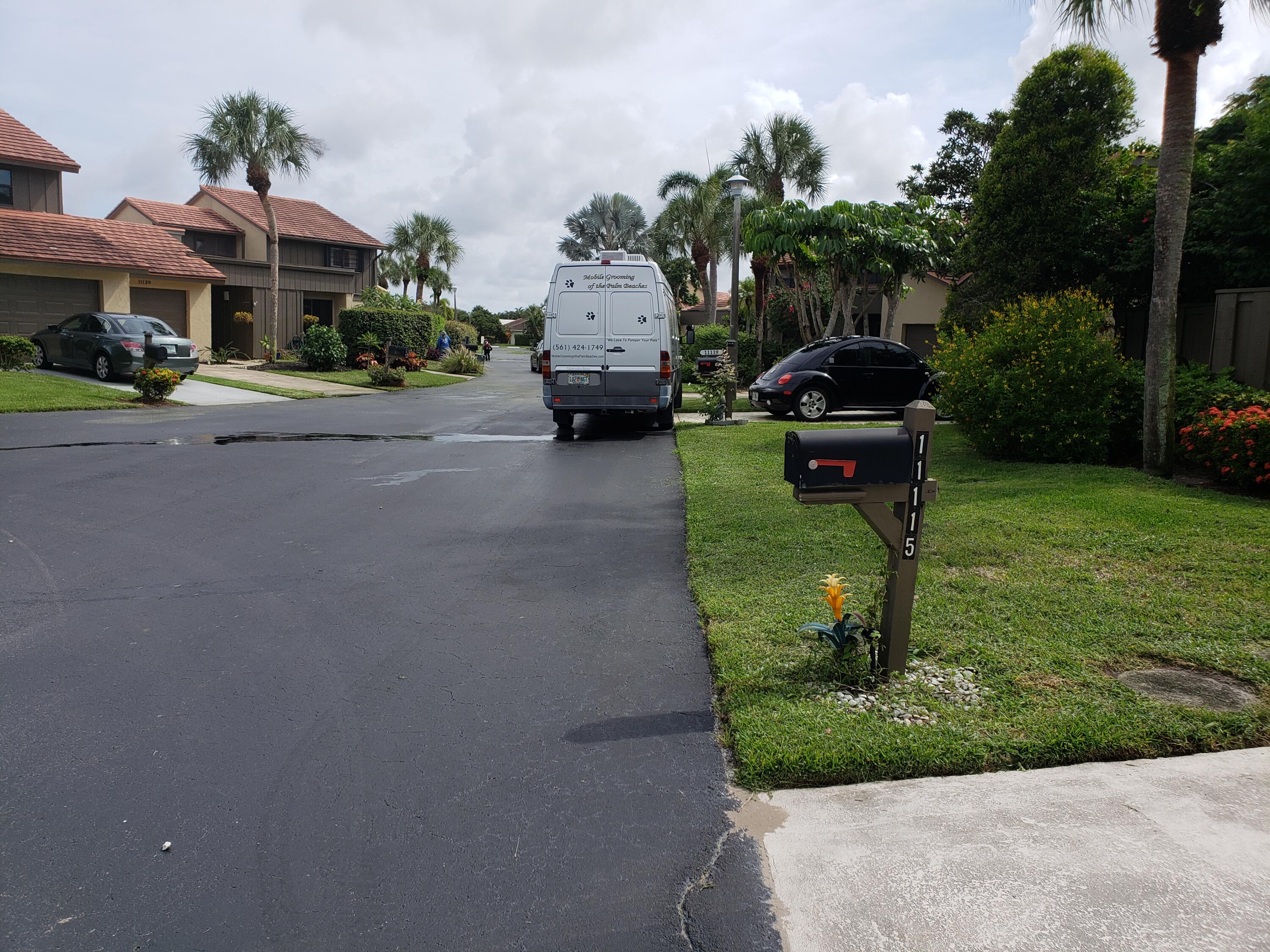 11115 Oakdale Road Boynton Beach, FL 33437 - Photo 2 of 30 a front view of a building with garden