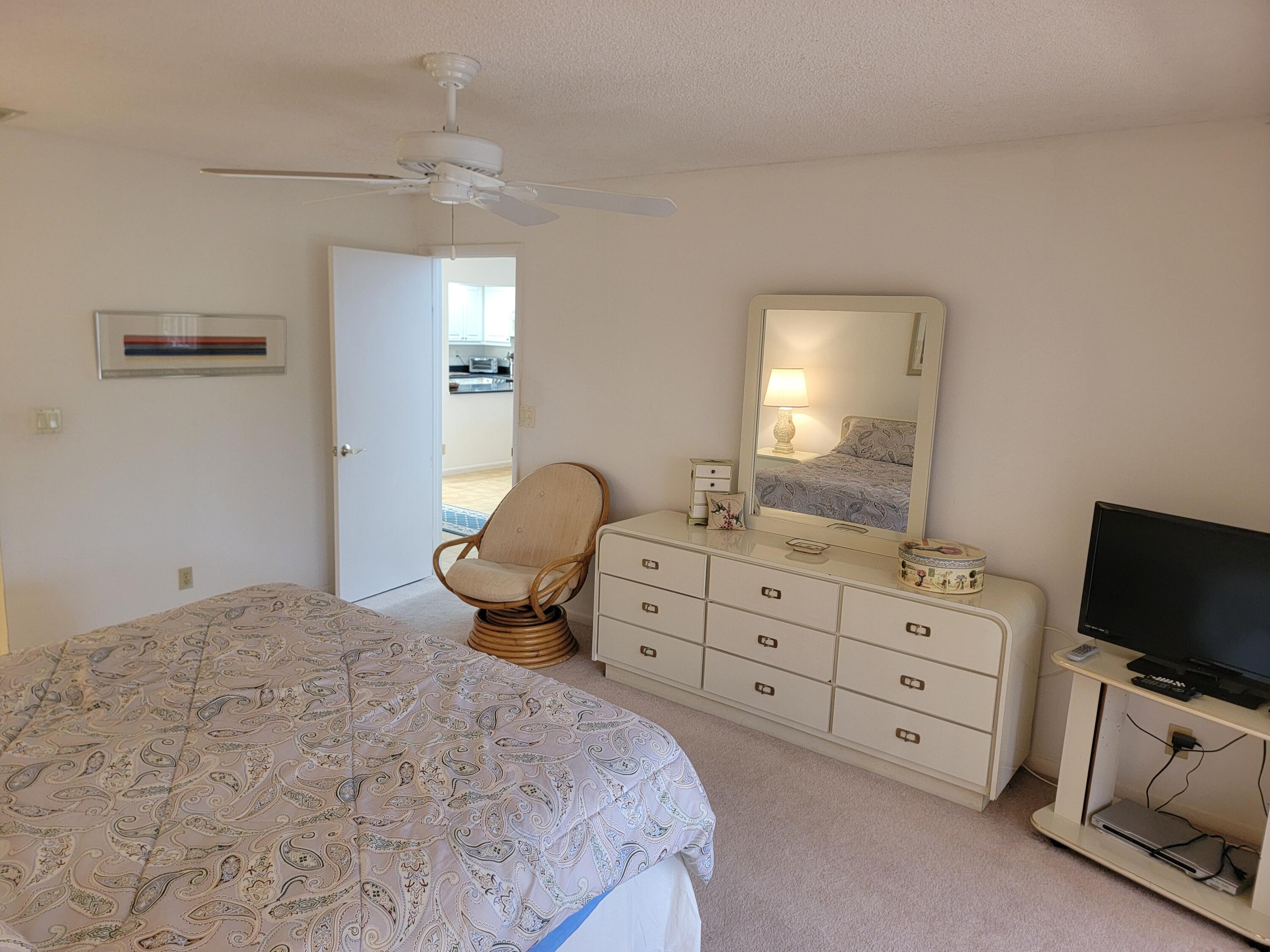 11115 Oakdale Road Boynton Beach, FL 33437 - Photo 23 of 30 a bedroom with a bed and a flat screen tv