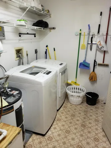 a kitchen with stainless steel appliances granite countertop a sink a stove and cabinets