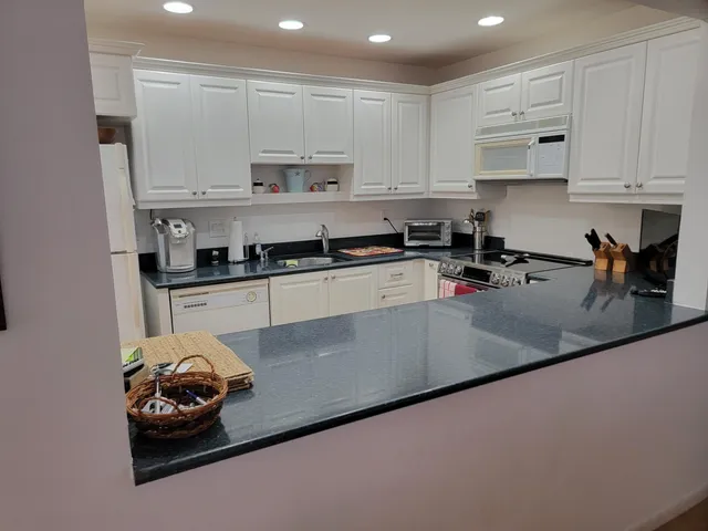 a bedroom with furniture and a rug