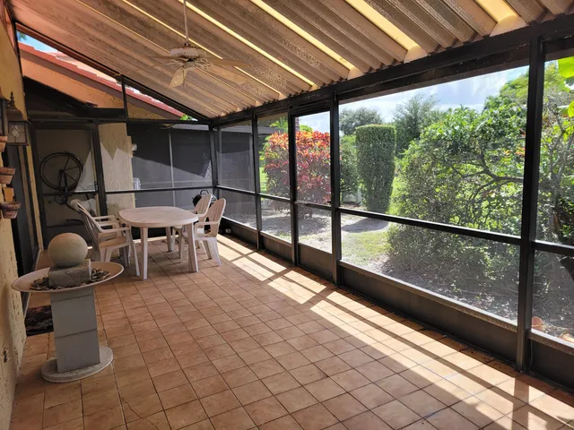 a lobby with furniture and next to a window