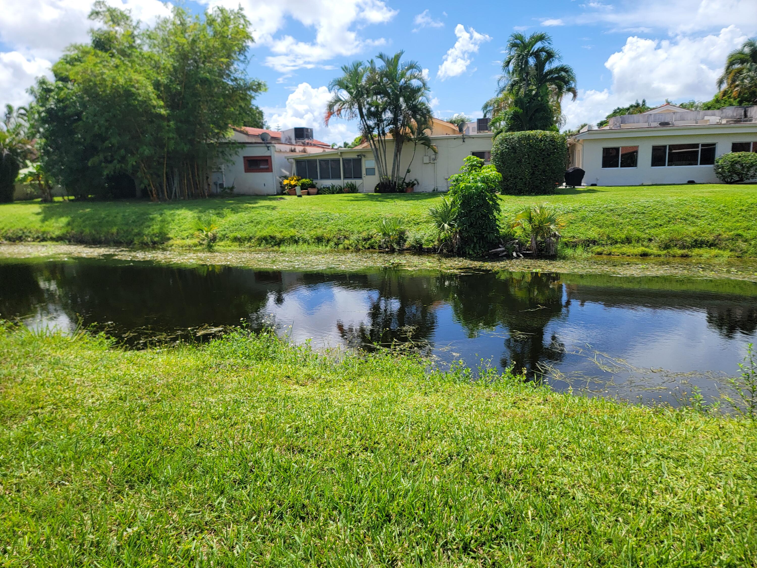 11115 Oakdale Road Boynton Beach, FL 33437 - Photo 8 of 30 front view of a house with a yard