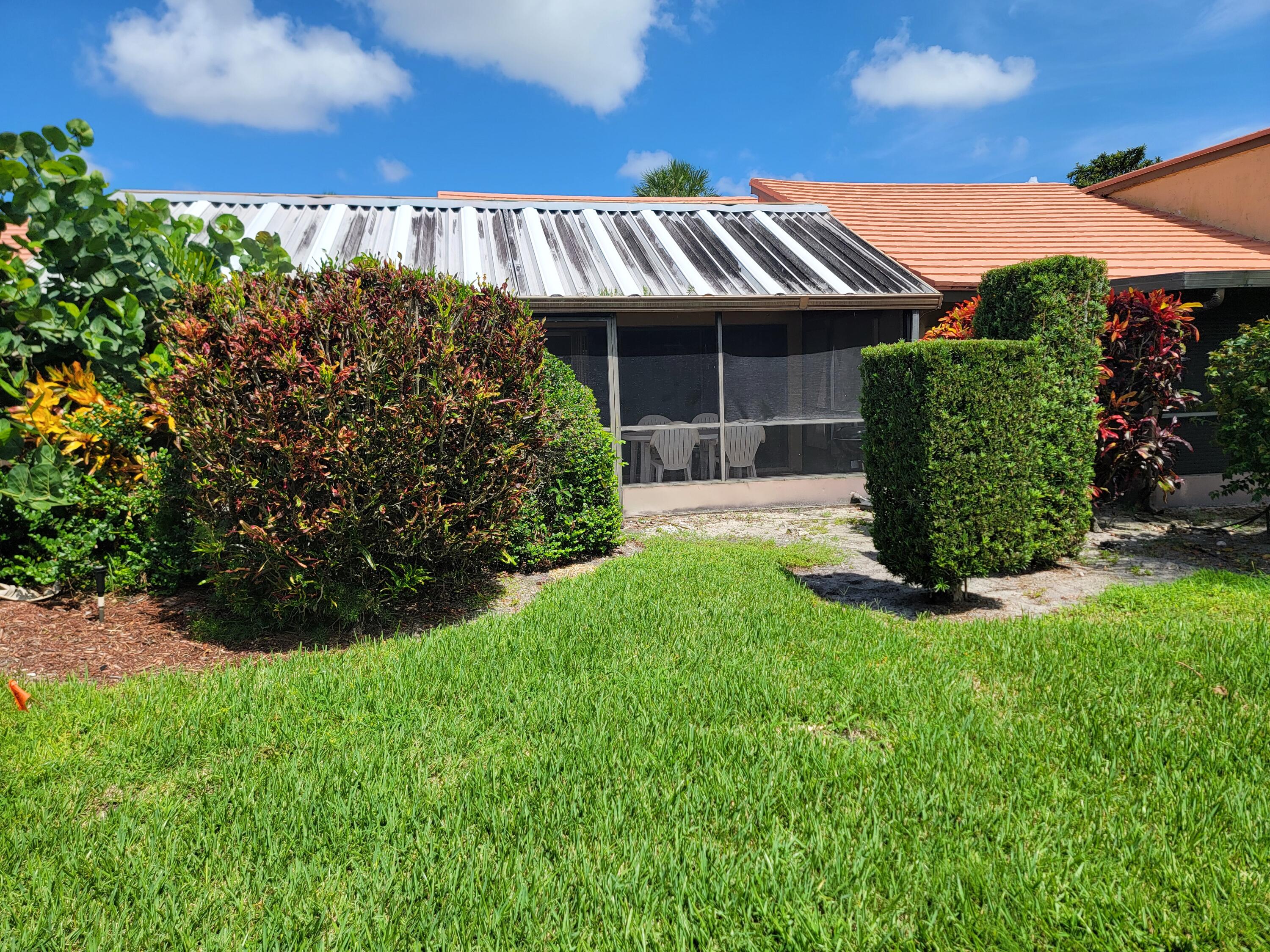 11115 Oakdale Road Boynton Beach, FL 33437 - Photo 10 of 30 a view of a back yard of the house and front view of a house