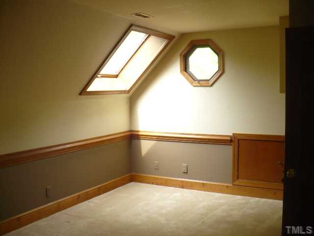228 Jansmith Lane Raleigh, NC 27615 - Photo 13 of 17 a view of a room with wooden floor and window