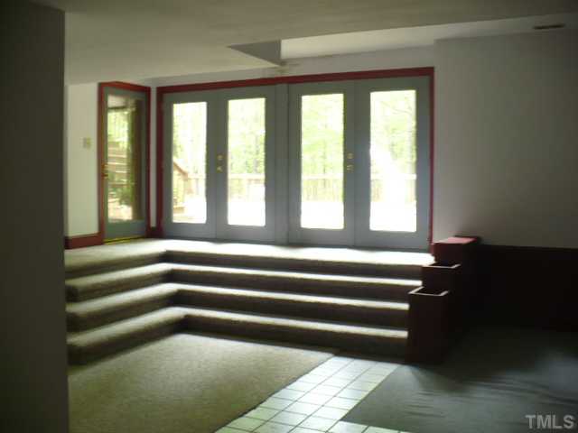 228 Jansmith Lane Raleigh, NC 27615 - Photo 15 of 17 a view of empty room with windows