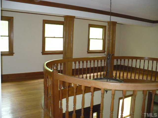 228 Jansmith Lane Raleigh, NC 27615 - Photo 8 of 17 a view of a porch with wooden floor