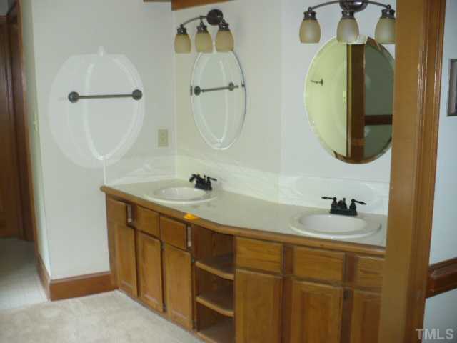 228 Jansmith Lane Raleigh, NC 27615 - Photo 10 of 17 a bathroom with a sink and mirror