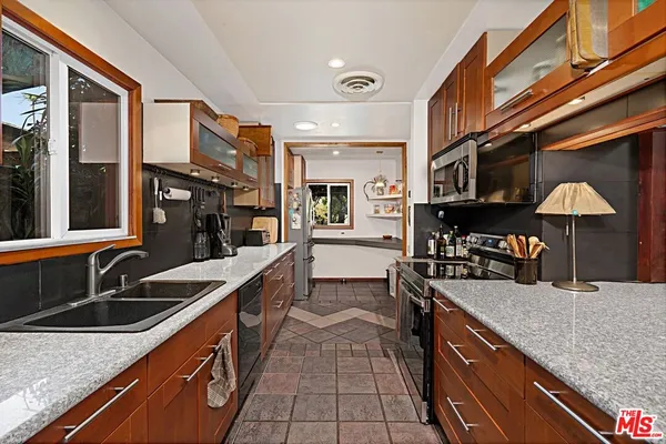 a room filled with lots of potted plants
