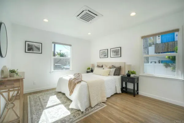 a bedroom with a bed and a window