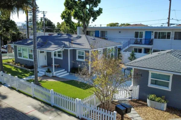 a view of a house with swimming pool and porch