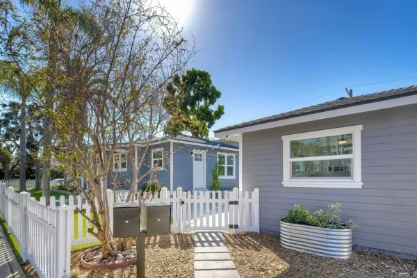 a front view of a house with garden