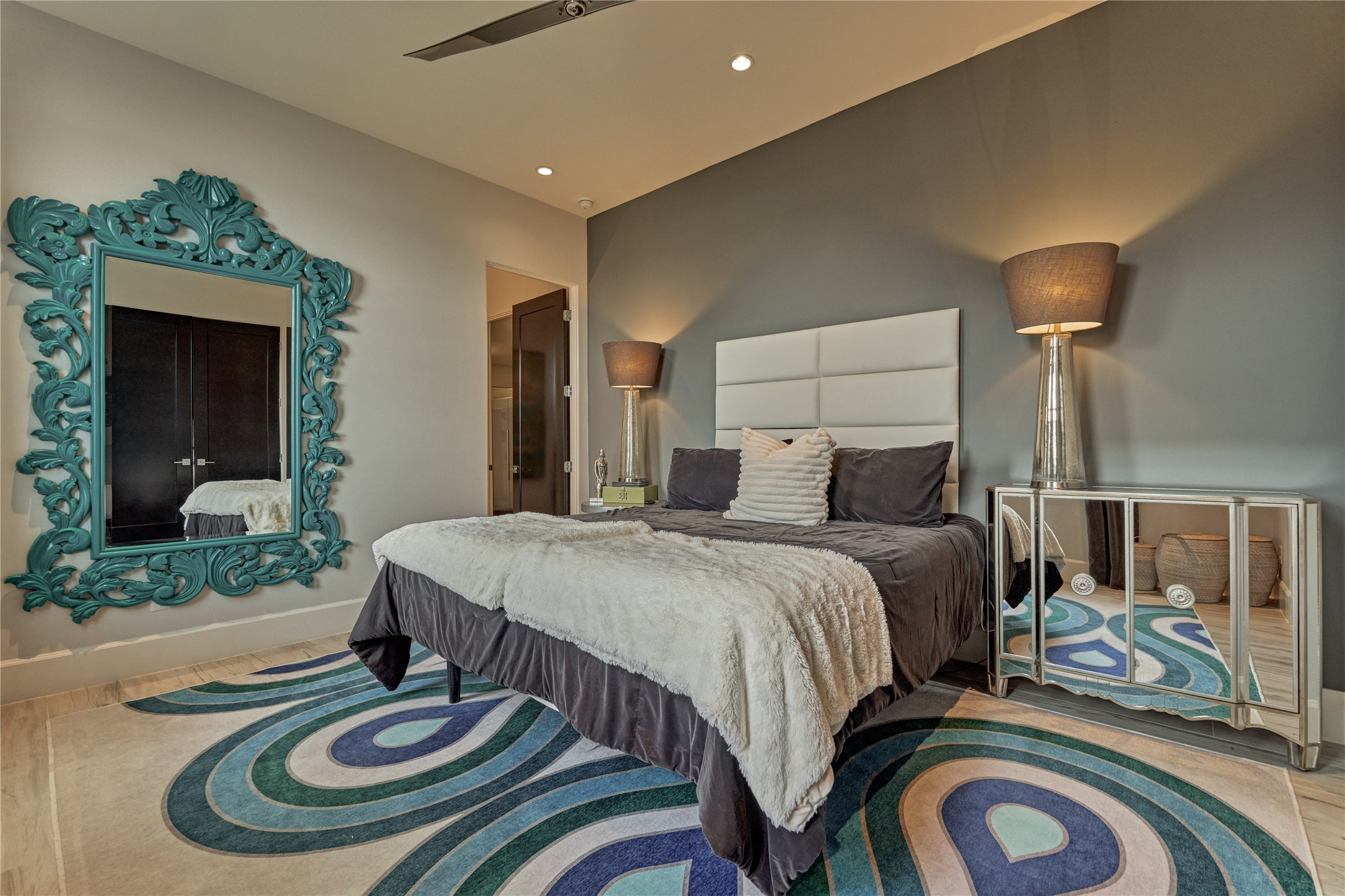 189 Stevinstraat Montgomery, TX 77356 - Photo 27 of 50 a bed room with a bed and a mirror