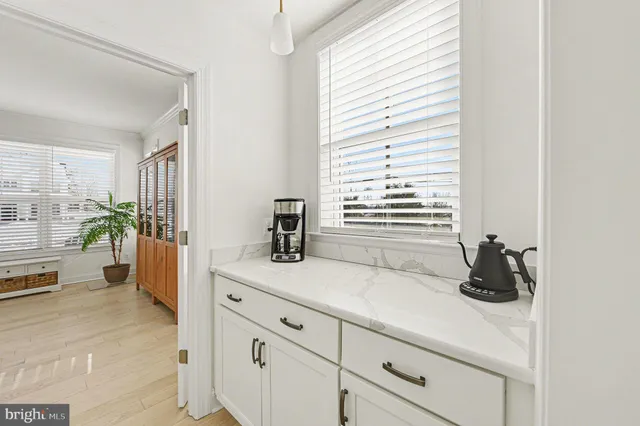 a en suite bathroom with a sink a mirror and a bathtub