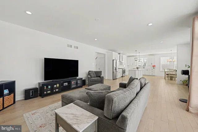 a living room with fireplace furniture and a flat screen tv